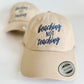 Beige cap with 'beaching not teaching' text on a white background. Embroidered custom hat stitched in Ontario, Canada. 
