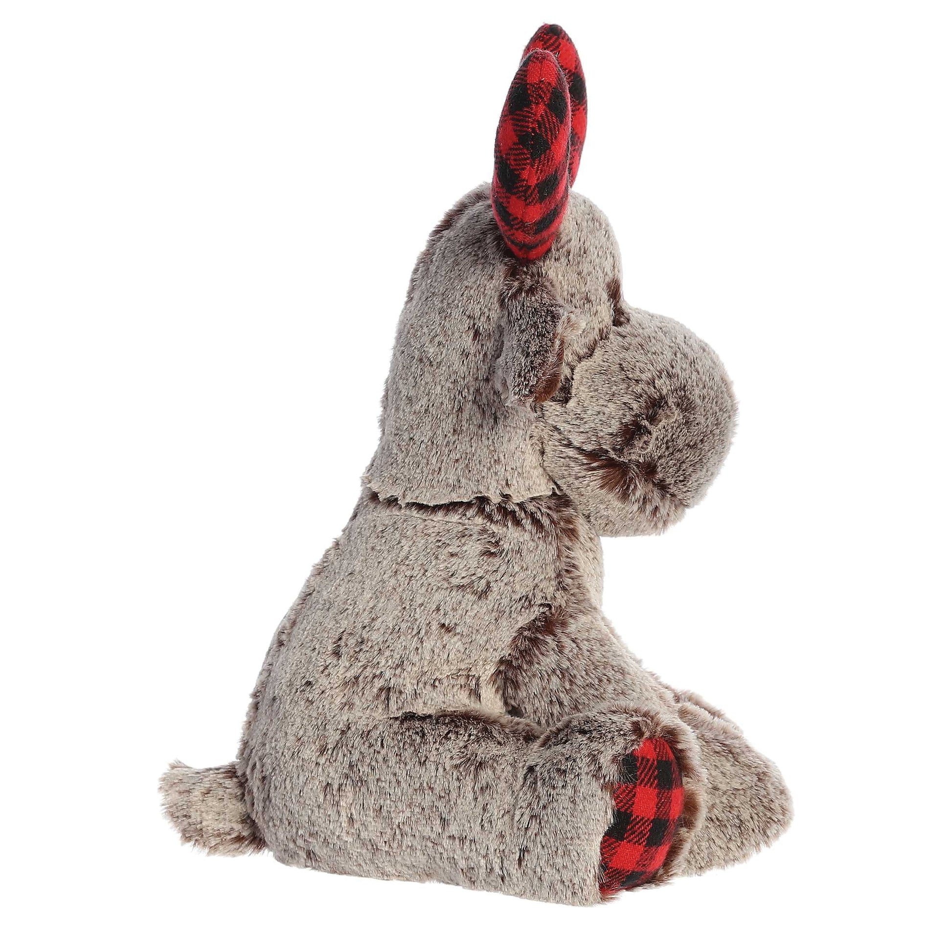 Plush toy elephant with red and black checkered ears on a white background