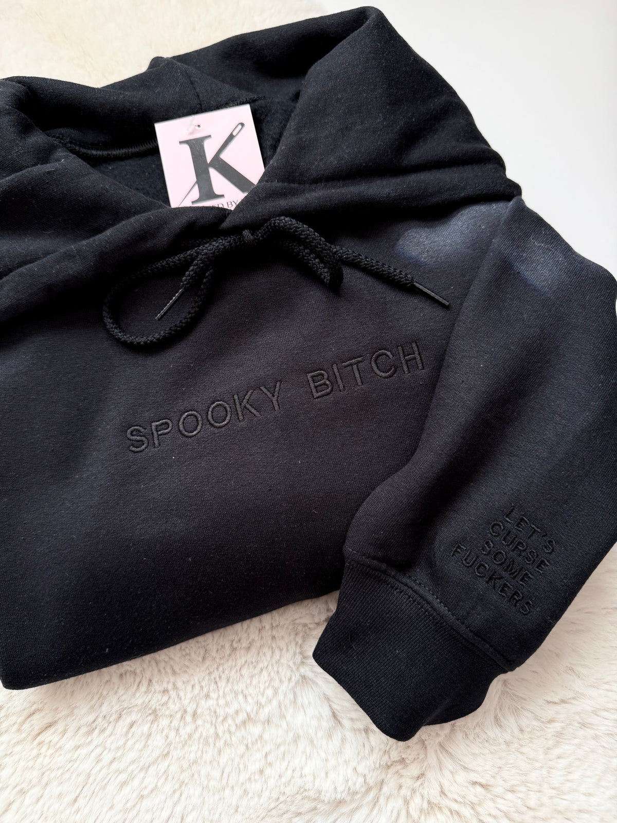 Sarcastic embroidered ‘spooky bitch’ black sweater, with custom sleeve ‘let’s curse some fuckers’. 