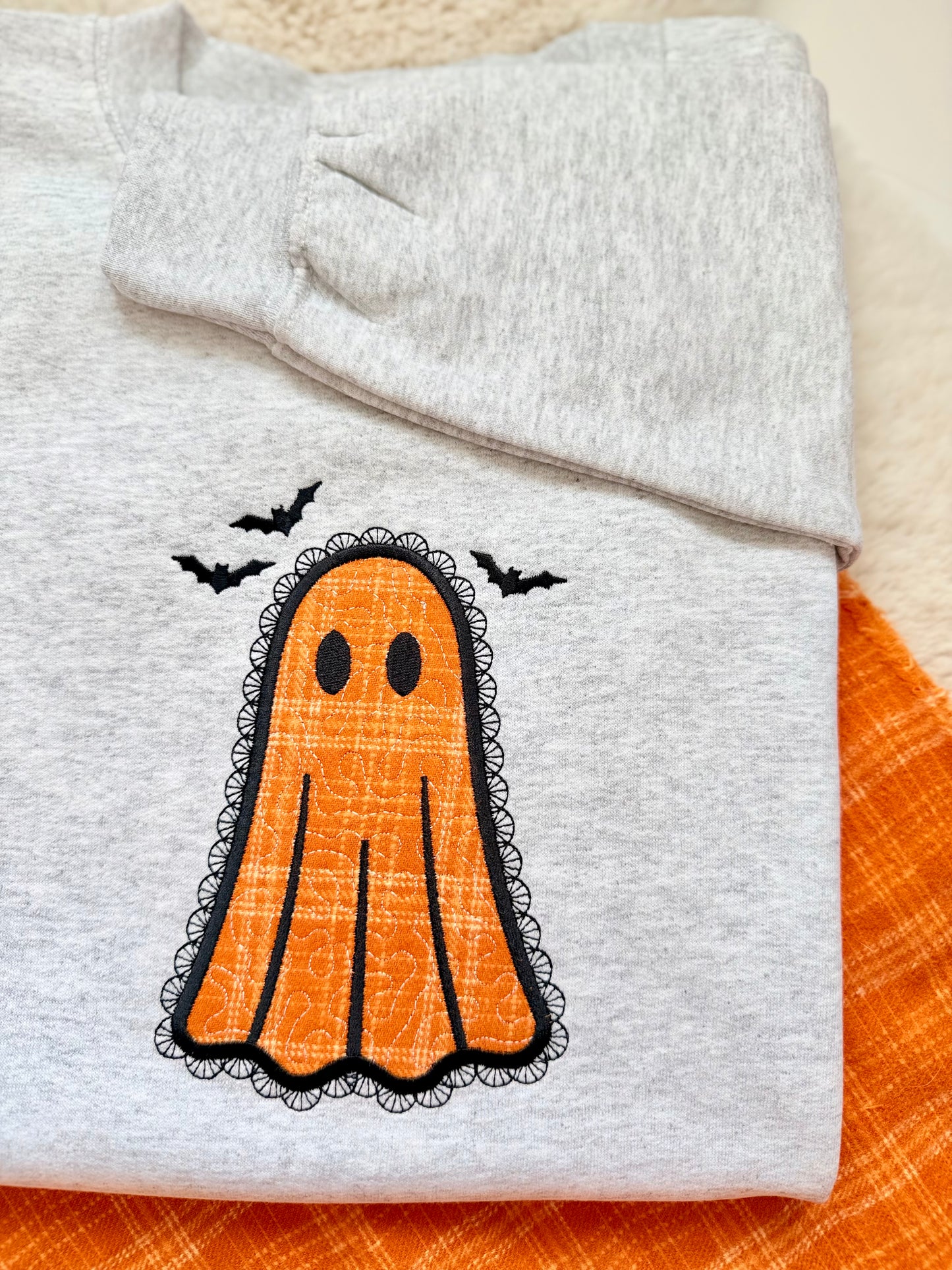 Lacey appliqued embroidered spooky cute Halloween ghost sweater.