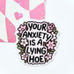 Sticker with text 'Your anxiety is a lying hoe' surrounded by floral designs on a white background.