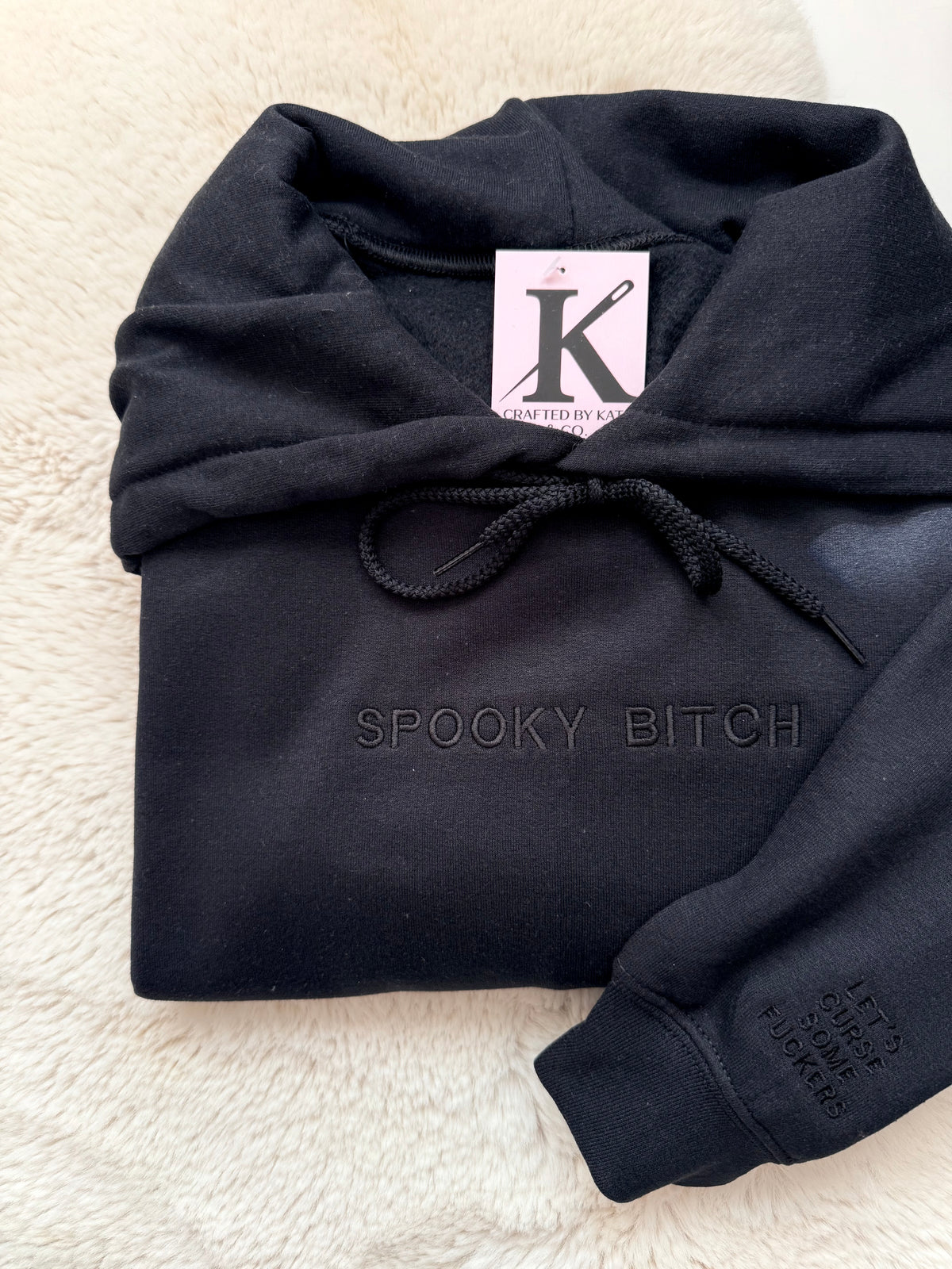 Sarcastic embroidered ‘spooky bitch’ black sweater, with custom sleeve ‘let’s curse some fuckers’. 