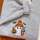 Meet the ultimate autumn mood: a cute embroidered ghost rocking a cozy orange toque, clutching an iced pumpkin spice coffee and a classic jack-o'-lantern. Designed with dense, high-quality embroidery for long-lasting wear, this cozy heather grey crewneck is the perfect mix of trendy and nostalgic for everyday spooky season style.