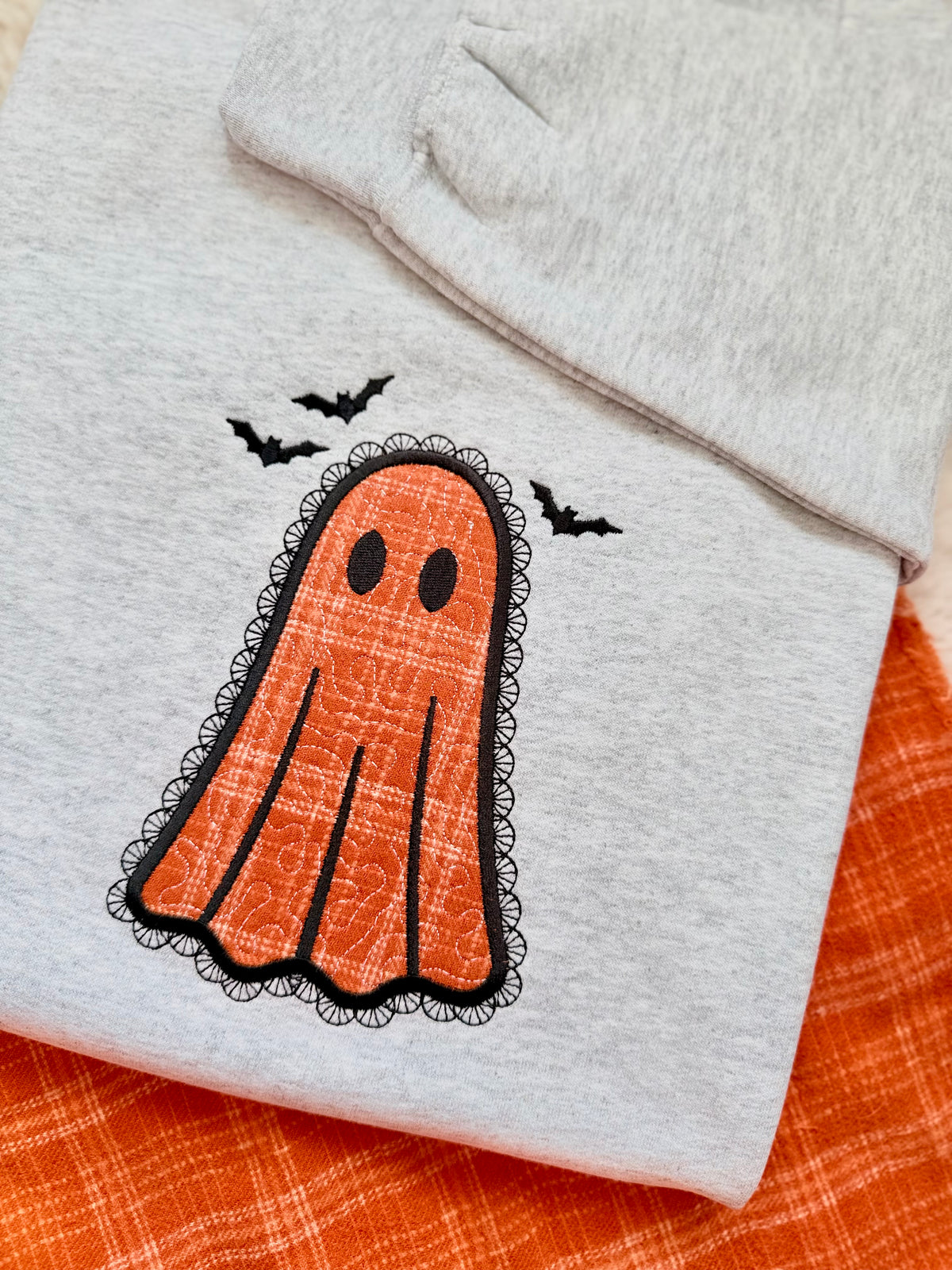 Lacey appliqued embroidered spooky cute Halloween ghost sweater.