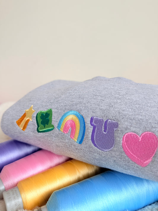 Gray knee-high sock with colorful designs on a light gray background