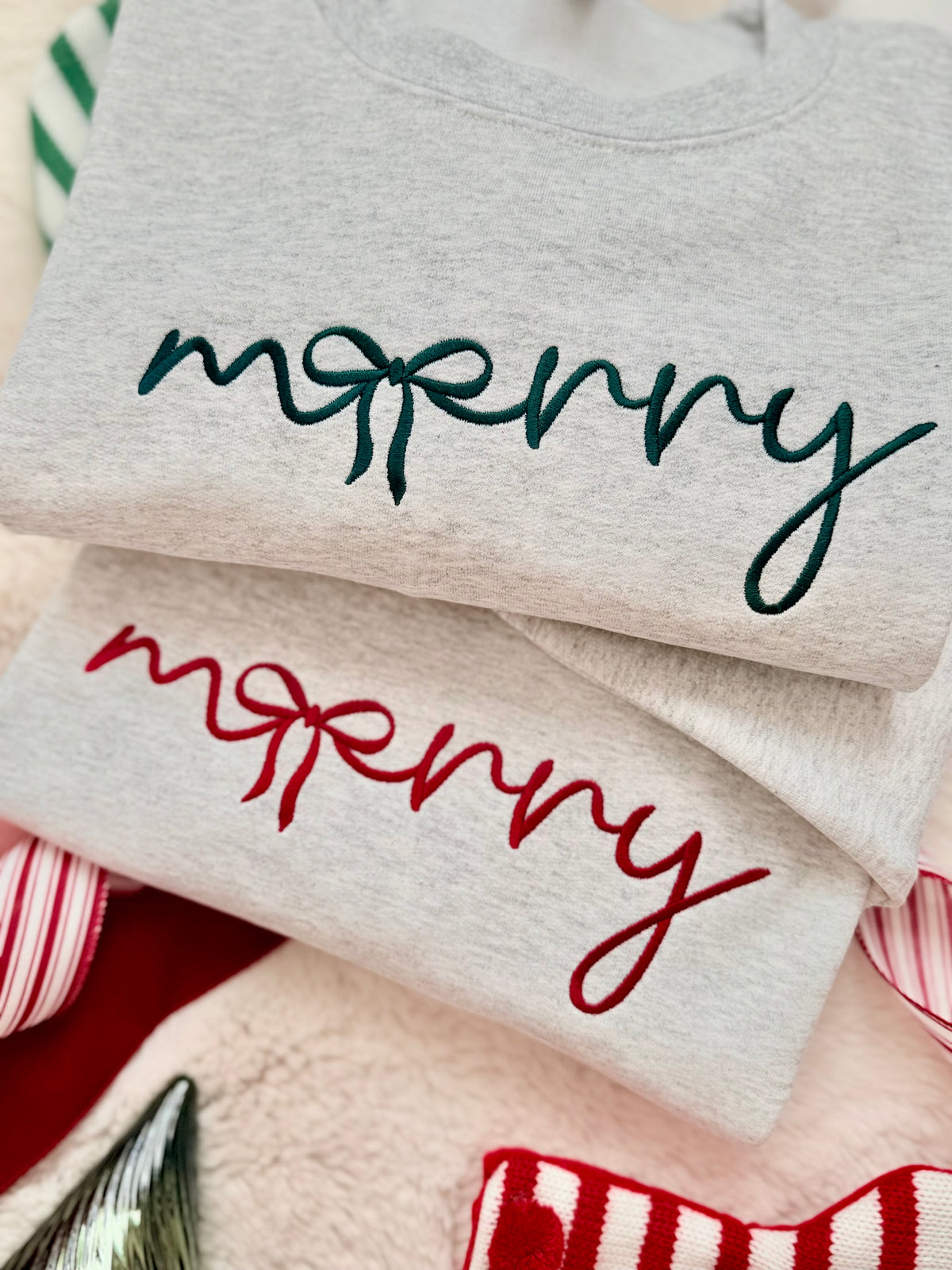 Our Merry Bow Embroidered Sweater is the perfect mix of cozy and Christmas charm! Featuring a beautiful handwritten-style "merry" design with a delicate bow incorporated into the lettering, this minimalist Christmas crewneck is a timeless addition to your holiday wardrobe.
