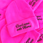 Pink beanies with 'Don't mess with Moms' text on a pink background