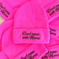 Pink beanies with 'Don't mess with Moms' text on a white background