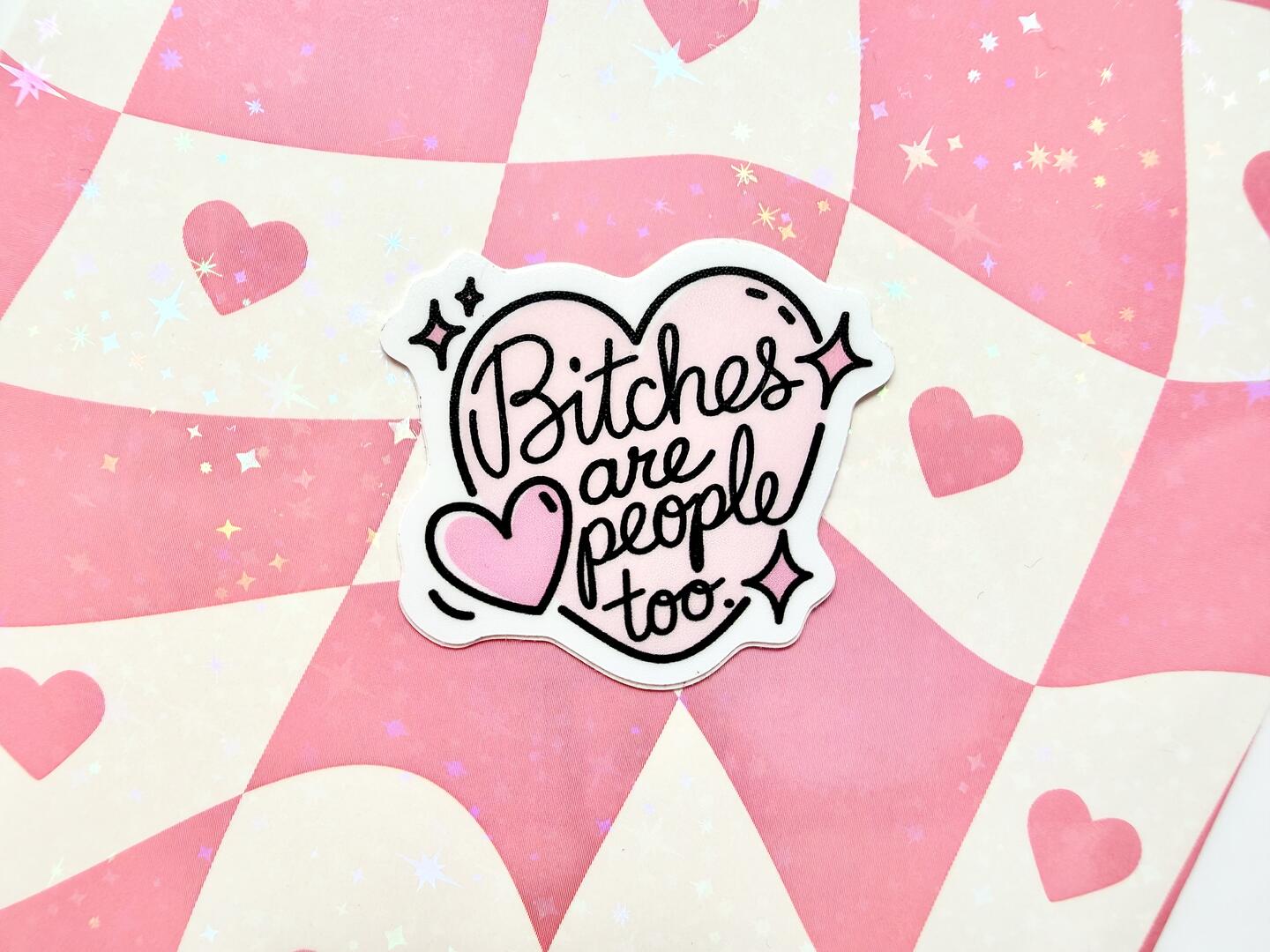 Sticker with 'Bitches are people too' text on a pink and white checkered background with hearts and stars.