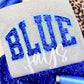 Gray fabric with blue glittery 'BLUE' text and white 'JAYS' text, surrounded by blue sequin applique embroidery.