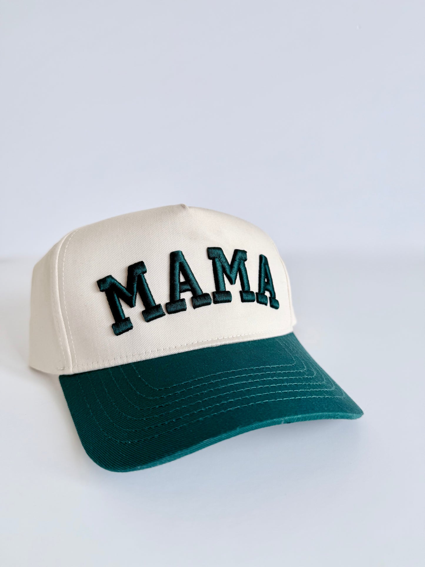 Cap with 'MAMA' text on a light gray background