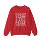 Red sweatshirt with 'I Come In Peace' text and Christmas-themed design on a white background
