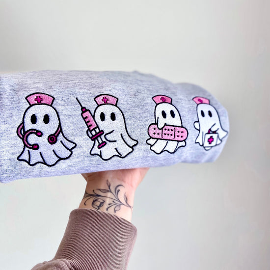 nurse ghostie sweater, nurse halloween sweater, boo boo crew sweater, embroidered nurse sweatshirt, spooky nurse crewneck, healthcare worker gift, nurse appreciation gift, cute nurse sweater, halloween nurse shirt, ghost nurse embroidery, cozy fall sweatshirt, hospital staff sweater, nurse life crewneck, pink ghost sweater, nurse thank you gift, rn halloween outfit, nurse crew gift, ghost embroidered sweatshirt, crafted by kate sweater, spooky season apparel